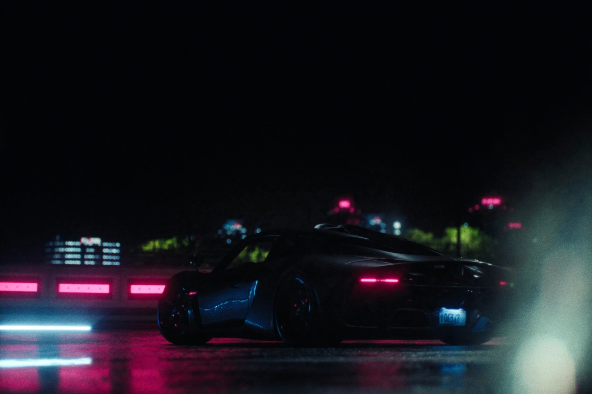Sports car at night with neon city lights